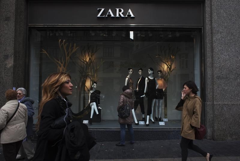People walk by one of Zara's stores in central Madrid December 14, 2011. u00e2u20acu201d Reuters pic