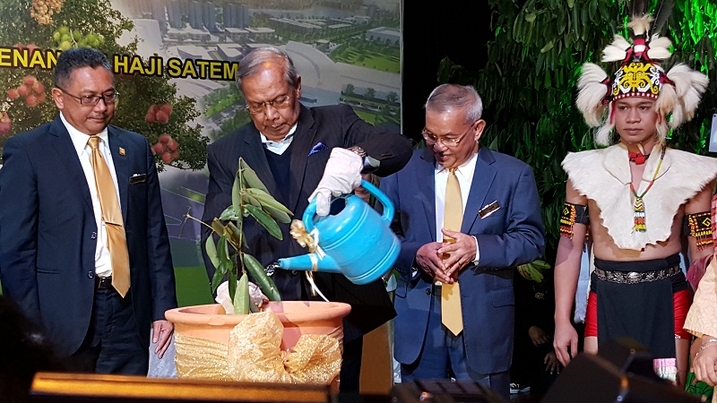 Chief Minister Tan Sri Adenan Satem pouring water on an u00e2u20acu02dcIntegrity Treeu00e2u20acu2122 which he has just planted in conjunction with SEDC Integrity Day. Seen looking on are SEDC general manager Soedirman Aini (left) and SEDC chairman Datuk Talib Zulpilip on Nov 4, 