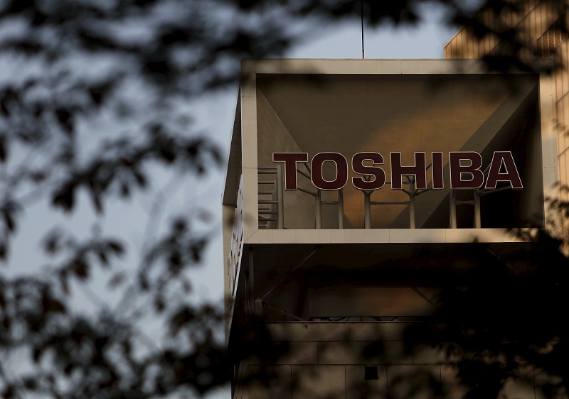 The logo of Toshiba Corp is seen behind trees at its headquarters in Tokyo, Japan, November 6, 2015. u00e2u20acu201d Reuters