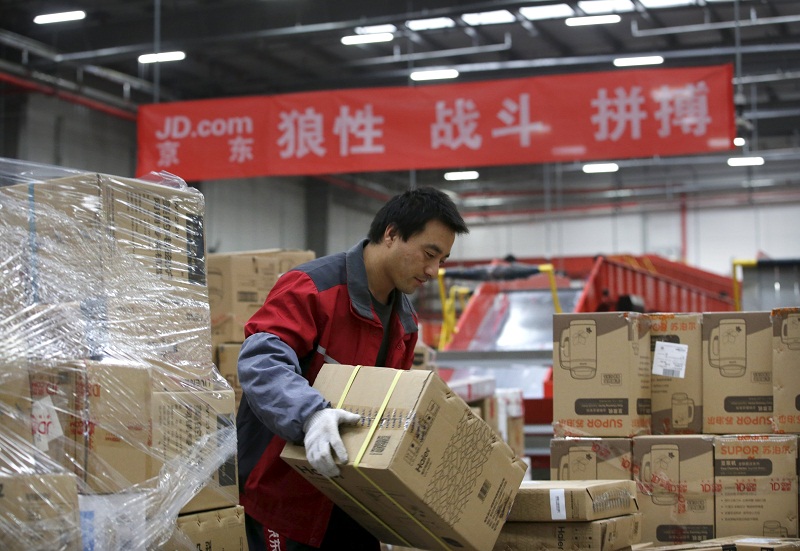 An employee works at a JD.com logistic centre in Langfang, Hebei province, November 10, 2015. u00e2u20acu201d Reuters pic