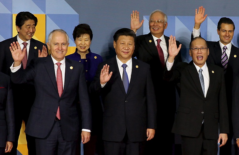Prime Minister Datuk Seri Najib Razak (back row, second from right) waves to the media after an official u00e2u20acu02dcfamily photou00e2u20acu2122 with other APEC leaders in Manila November 19, 2015. u00e2u20acu201d Reuters pic