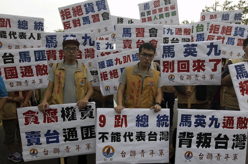Activists protest against the upcoming Singapore meeting between Taiwan's President Ma Ying-jeou and Chinese President Xi Jinping outside Taipei Songshan airport, November 7, 2015. u00e2u20acu201d Reuters pic