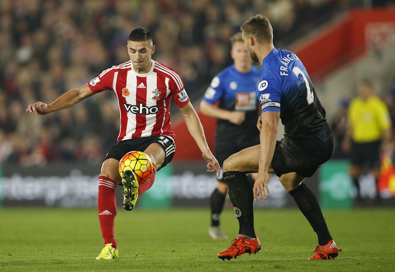 Southampton's Dusan Tadic in action with Bournemouth's Simon Francis during the Southampton v AFC Bournemouth Barclays Premier League match at St Mary's Stadium. u00e2u20acu201d Reuters pic