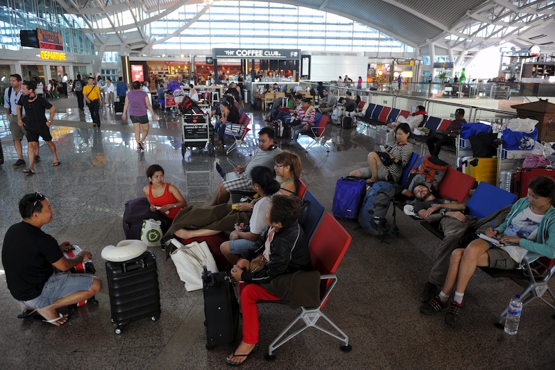 Passengers spend their time at a waiting room as all flights are cancelled at the Ngurah Rai airport in Bali, November 4, 2015 in this picture taken by Antara Foto. u00e2u20acu201d Reuters pic