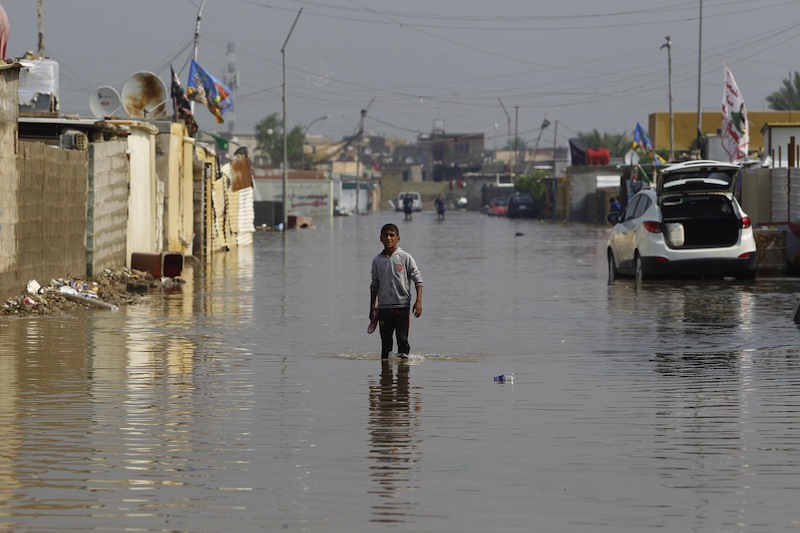 A boy stands at a flooded street after heavy rainfall in Baghdad, Iraq October 31 2015. u00e2u20acu201d Reuters pic