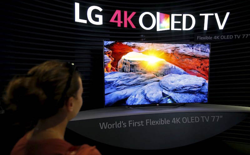 A visitor looks at an LG 4K OLED TV screen at the IFA consumer technology fair in Berlin, in this September 5, 2014 file photo. u00e2u20acu201d Reuters pic