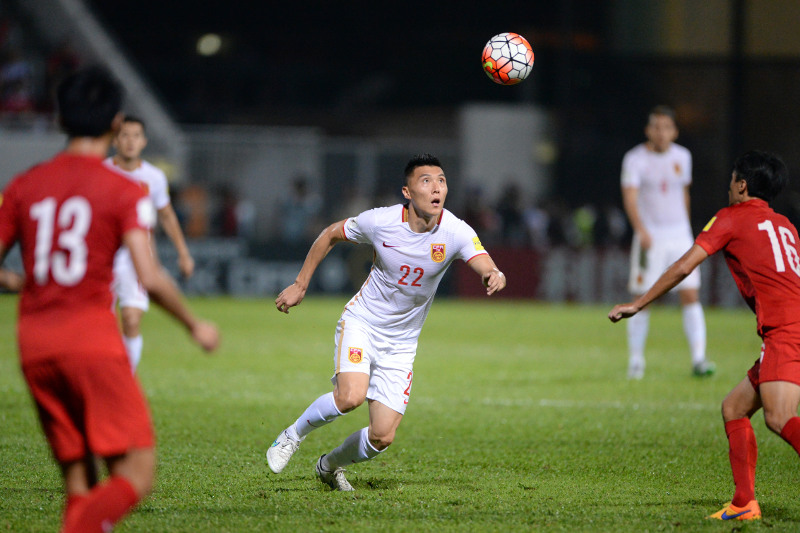 Chinau00e2u20acu2122s Yu Dabao (centre) eyes the ball during the 2018 FIFA world cup qualifier football match against Hong Kong at Mong Kok stadium in Hong Kong on Nov 17, 2015. u00e2u20acu201d AFP pic