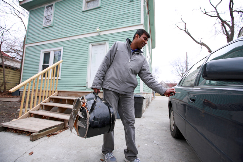 Abhishek Utekar, who came from India and is now working on his second graduate degree, outside the house he bought and is fixing up, in Flint, Michigan, March 26, 2015. u00e2u20acu201d Fabrizio Costantini/The New York Times pic