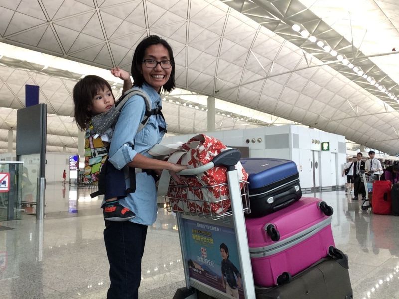 Babywearing helps me keep my toddler contained and make schlepping through airports a breeze.