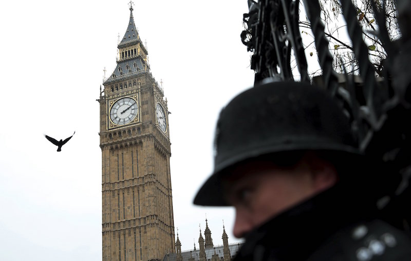 A bird flies overhead as a policeman guards Houses of Parliament in London November 14, 2015, after security was heightened following the attacks on Paris. u00e2u20acu201d Reuters pic