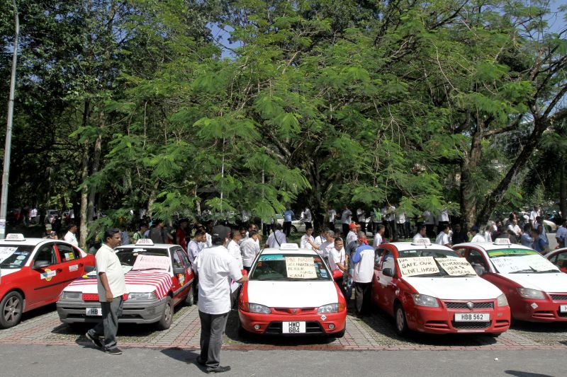 Taxi drivers gather at the Padang Merbok to protest against Uber and Grabcar in Kuala Lumpur, November 18, 2015. u00e2u20acu2022 Picture by Yusof Mat Isa