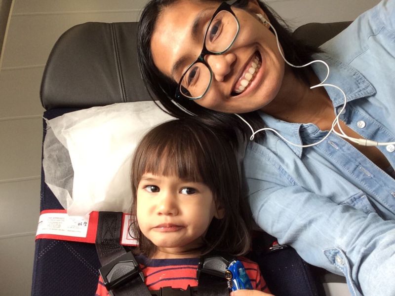 My two-year-old using the CARES harness during our flight to Hong Kong.