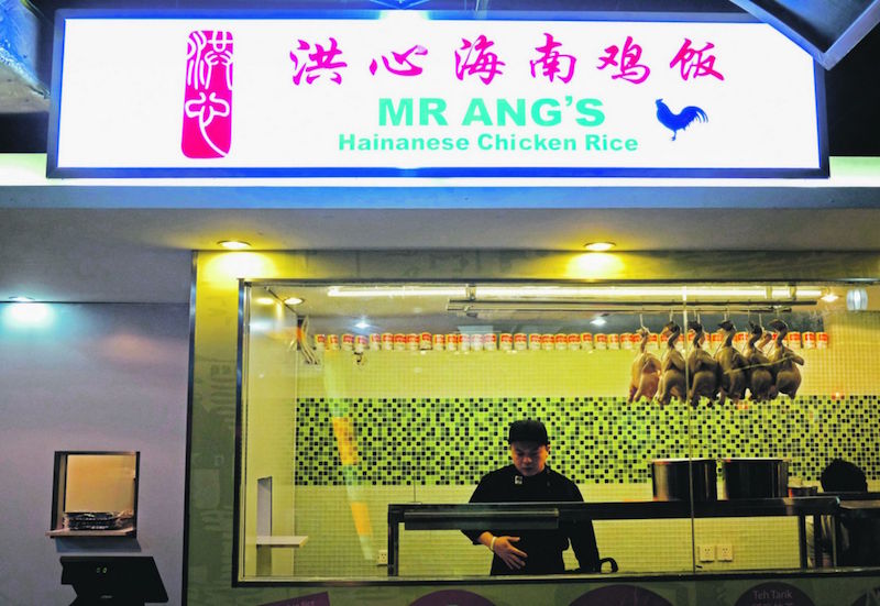 Xander Ang with his new and very own Mr Ang Hainanese Chicken Rice shop. u00e2u20acu201d TODAY pic