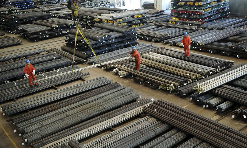 File picture shows workers directing a crane lifting newly-made steel bars at a factory of Dongbei Special Steel Group Co Ltd, in Dalian, Liaoning province, China, October 13, 2015. u00e2u20acu201d Reuters/China Daily pic