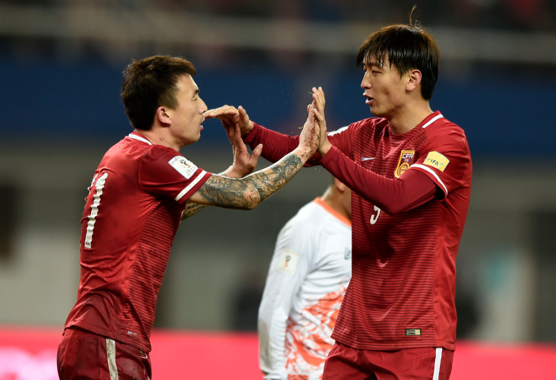 File picture shows Yang Xu of China (right) and teammate Wang Yongpo celebrating during their 2018 FIFA World Cup qualifying match against Bhutan in Changsha, in Chinau00e2u20acu2122s Hunan province on Nov 12, 2015. u00e2u20acu201d AFP pic