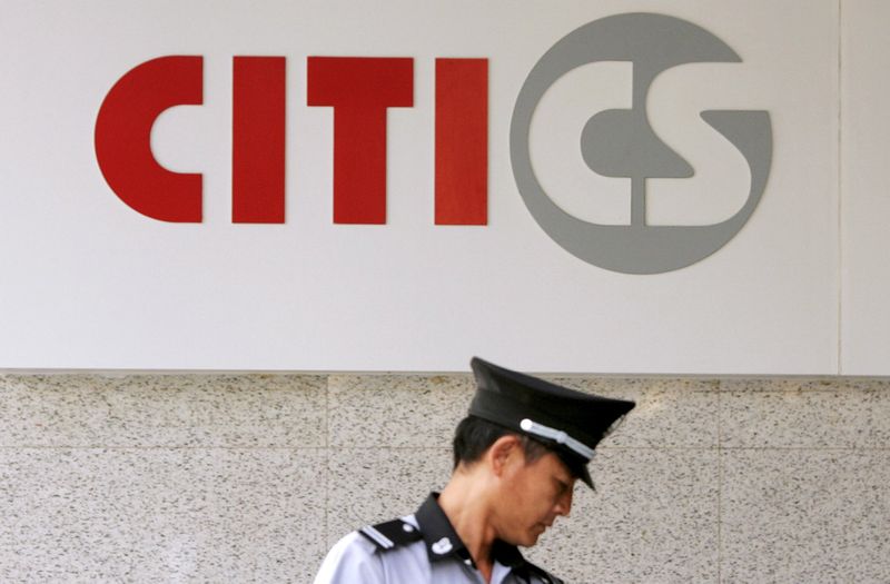 A security guard is seen under the logo of CITIC Securities at a branch of the security brokerage house in Shanghai, in this September 18, 2008 file photo. u00e2u20acu201d Reuters pic 