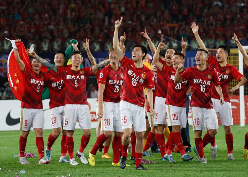 China's Guangzhou Evergrande players celebrating their win in the AFC Champions League football final against UAE's Al Ahli in Guangzhou, November 21, 2015. u00e2u20acu201d AFP pic