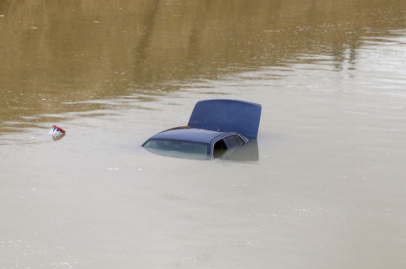 A car is submerged in flood waters following heavy rain, in Riyadh, Saudi Arabia November 25, 2015. Rare flooding in Qatar also brought the gulf state to a standstill. u00e2u20acu201d Reuters pic n