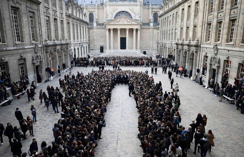 French President Francois Hollande stands among students to observe a minute of silence at the Sorbonne University in Paris in tribute to victims of Friday's Paris attacks, November 16, 2015. u00e2u20acu201d Reuters pic