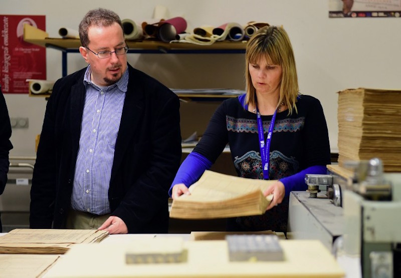 Director of Budapest City Archives, Istvan Kenyeres, and chief-restorer Adrienn P Holl stand next to documents dating from 1944 that are part of around 6,300 census forms of Budapestu00e2u20acu2122s then Jewish population in Budapest November 12, 2015. u00e2u20acu201d AFP pic