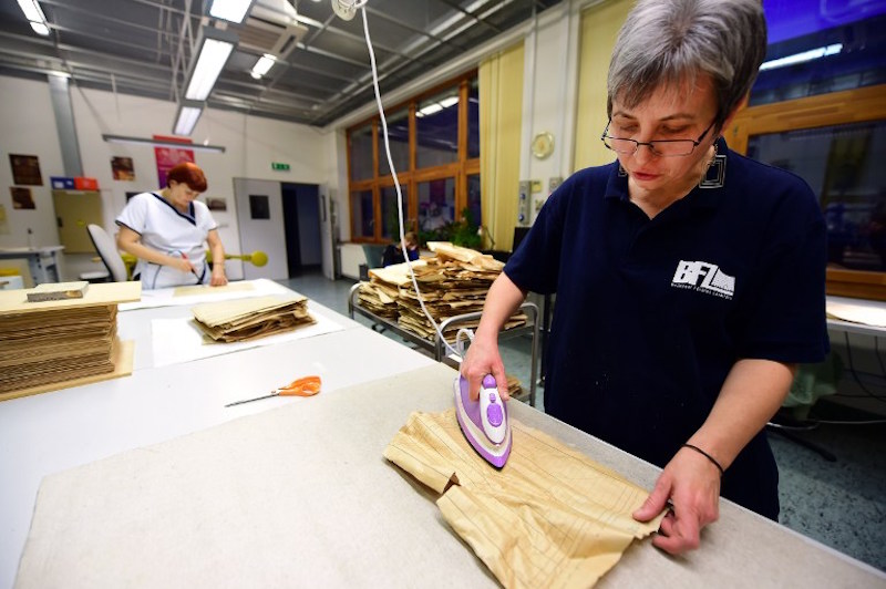 Klara Tobi, restorer of the Budapest City Archives, prepares a document dating from 1944 that is part of around 6,300 census forms of Budapest's then Jewish population with an electric iron in Budapest November 12, 2015. — AFP pic