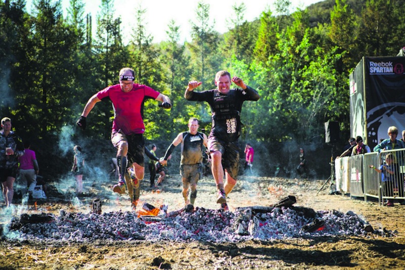 Joe DeSena tackling the obstacles at the Spartan Race. u00e2u20acu201d AFP pic