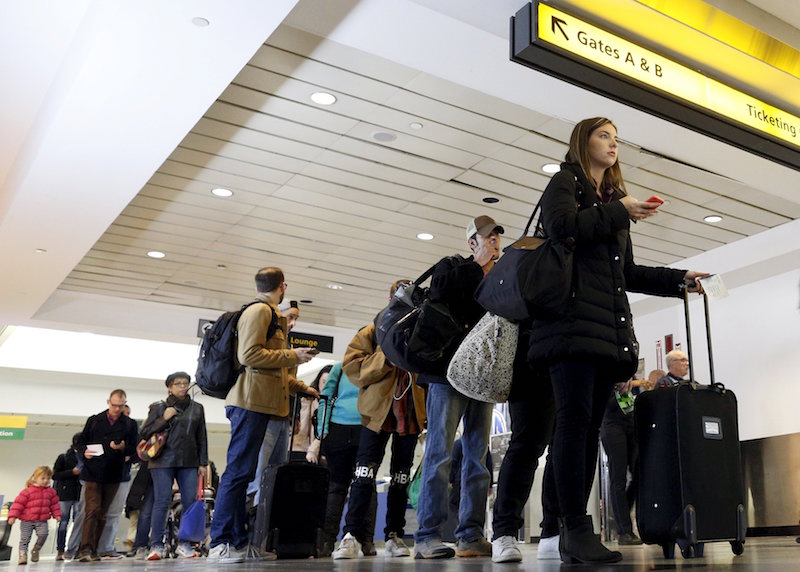 Travellers wait in line at a security checkpoint at La Guardia Airport in New York November 25, 2015. u00e2u20acu201d Reuters pic