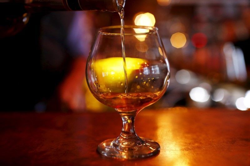 A glass of cognac on a bar in the Manhattan borough of New York City, November 13, 2015. REUTERS/Mike Segar