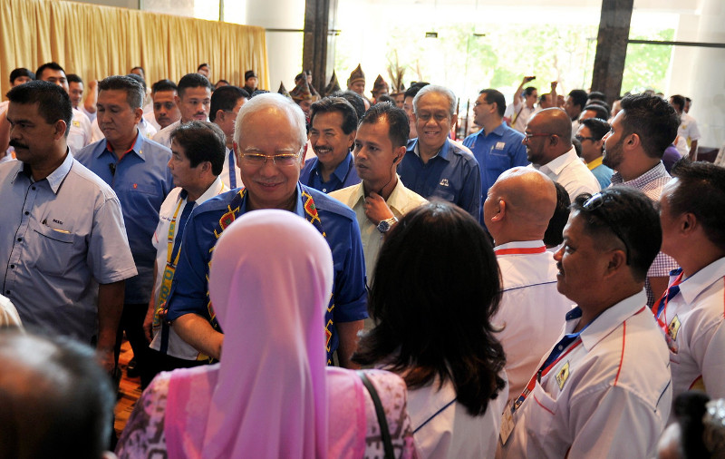 Prime Minister Datuk Seri Najib Razak accompanied by Sabah Chief Minister Datuk Seri Musa Aman shaking hands with supporters attending the opening the PBRS Tri-Annual Conference in Kota Kinabalu, Nov 1, 2015. u00e2u20acu201d Bernama pic