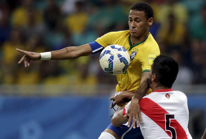 Neymar (left) of Brazil fights for the ball with Carlos Zambrano of Peru during their 2018 World Cup qualifying match in Salvador, Brazil, November 17, 2015.  u00e2u20acu201d Reuters pic