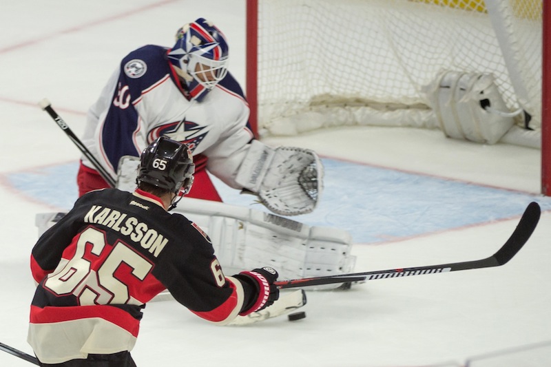 Columbus Blue Jackets goalie Curtis McElhinney (30) makes a save on a shot from Ottawa Senators defenseman Erik Karlsson (65) in the third period at Canadian Tire Centre. u00e2u20acu201d Reuters pic