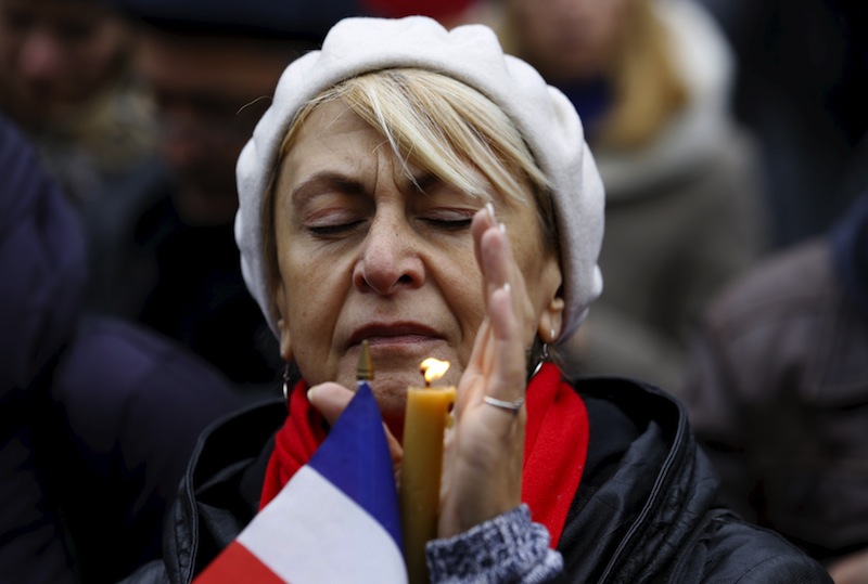 Lena Polyvyannaya of Toronto closes her eyes during a moment of silence in memory of the victims of Paris attacks, outside city hall in Toronto November 14, 2015. u00e2u20acu201d Reuters pic