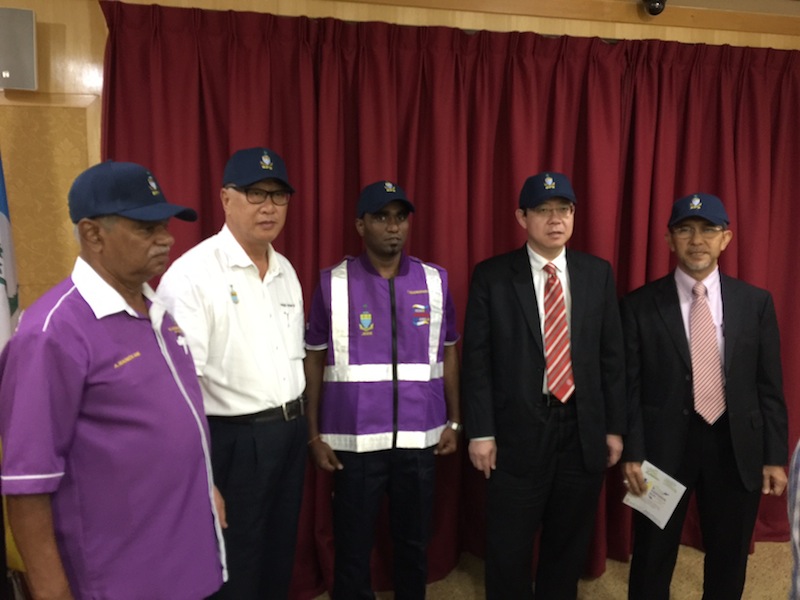 Penang Chief Minister Lim Guan Eng, Deputy Chief Minister I Datuk Mohd Rashid Hasnon (right), state executive councillor Phee Boon Poh and former PPS chief coordinator Manickam Alagappan (left) in the new BPS uniform and caps. u00e2u20acu201d Picture by Opalyn Mok