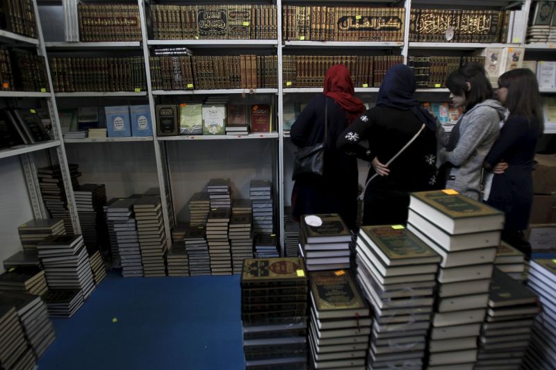 Women look at religious books at the 20th International Book Fair (SILA) in Algiers, November 02, 2015. Organisers confiscated more than 100 books on jihadism and the Arab Spring, highlighting sensitivities over regional turmoil. REUTERS/Ramzi Boudina