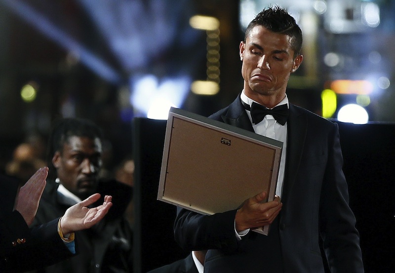 Cristiano Ronaldo reacts as he receives a certificate on the red carpet at the world premiere of 'Ronaldo' at Leicester Square in London, Britain November 9, 2015. u00e2u20acu201d Reuters pic