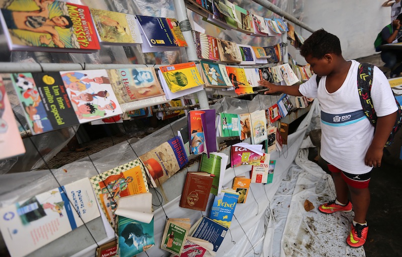 A boy visits the Slums Book Fair, FLUPP, at the Chapeu Mangueira - Babilonia slum in Rio de Janeiro, Brazil, on November 5, 2015. u00e2u20acu201d AFP pic