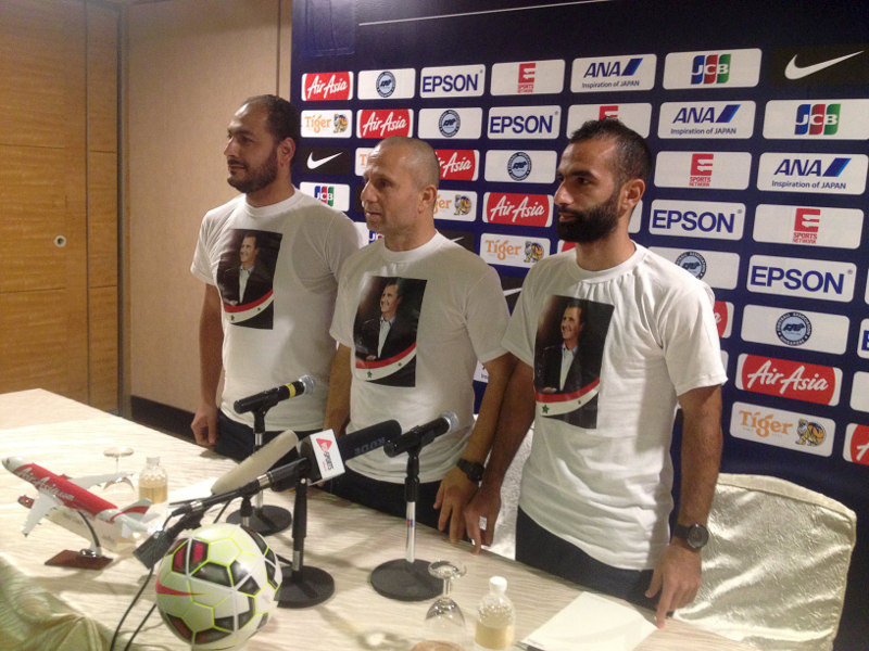 (From left) Syrian football association unknown official, head coach Fajr Ibrahim, and midfielder Osama Omari attend a news conference at a hotel in Singapore, November 16, 2015. u00e2u20acu201d Reuters pic