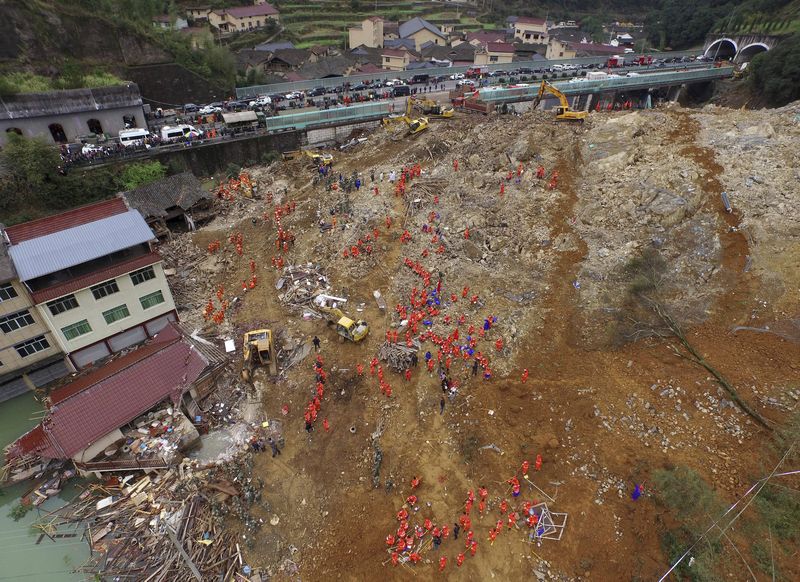 Aerial view of rescuers searching for survivors among debris at the site of a landslide in Yaxi township of Lishui, Zhejiang province, November 14, 2015. u00e2u20acu201d Reuters pic