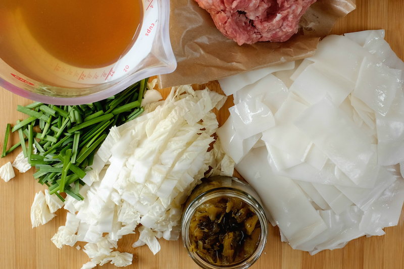 Yunnan-style noodle soup begins with ground pork, vegetables, noodles and prepared broth. — Picture by Josh Wand/Reuters