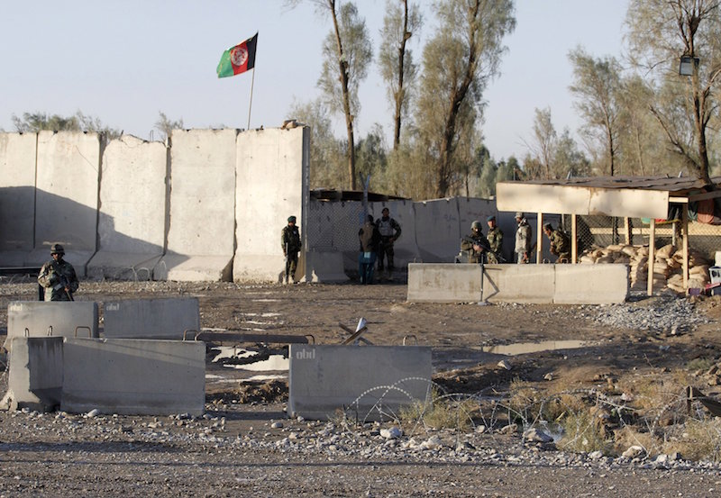 Afghan security forces stand guard at the entrance gate of Kandahar Airport where Taliban stormed on late Tuesday, in Kandahar, Afghanistan December 9, 2015. u00e2u20acu201d Reuters pic