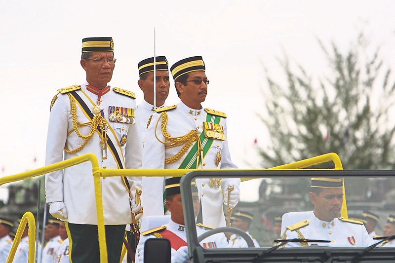 Yunus (left) accompanying the 13th Yang di-Pertuan Agong Tuanku Mizan Zainal Abidin in a parade. — Picture by Malay Mail