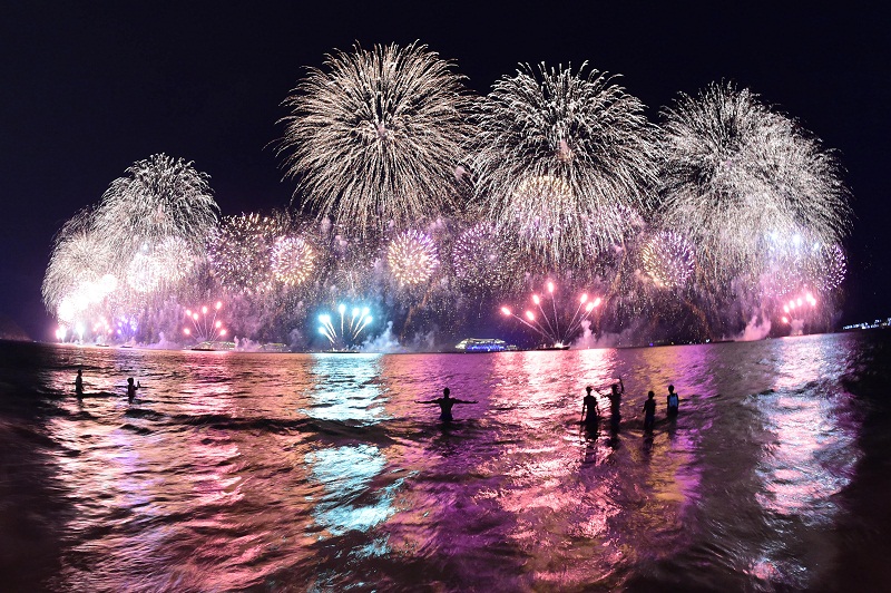 People take a dip in the sea during the fireworks for the new year on Copacabana beach in Rio de Janeiro on January 1, 2015. u00e2u20acu201d AFP pic