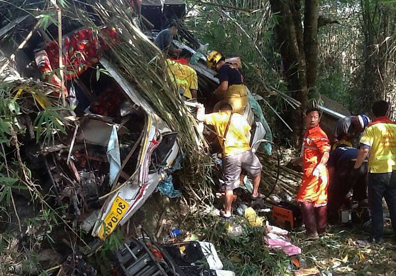 This photo taken on December 20, 2015 shows Thai rescue workers trying to find survivors following a bus crash in Doi Saket district ,30 kilometres from the northern city of Chiang Mai. u00e2u20acu201d AFP pic