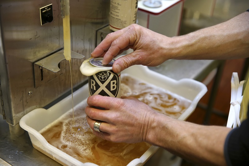 Cans of the ESB are filled one at a time at Rockaway Brewery in New York, November 23, 2015. u00e2u20acu201d Picture by Richard Perry/The New York Times