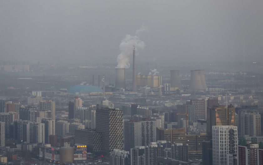 Beijingu00e2u20acu2122s skyline and a power plant are seen from a high-rise building as China warned residents across a large part of northern China to prepare for a wave of choking smog arriving over the weekend, in Beijing, China, December 19, 2015. u00e2u20acu201d Reuters pic