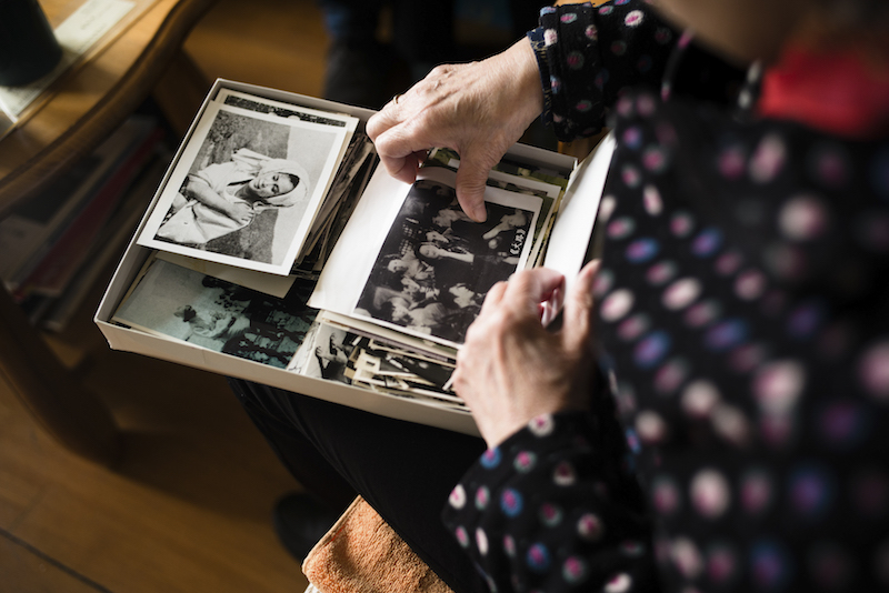 Qin Yi looks through old photos from her days as an actress, at her apartment in Shanghai November 18, 2015. — Picture by Eric LeLeu/The New York Times
