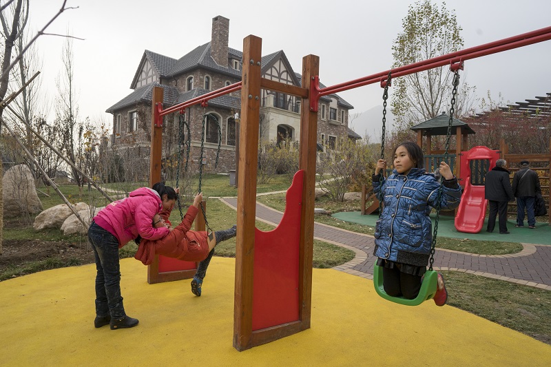 Children playing at Jackson Hole in Hebei province in China, November 14, 2015. Roughly a two-hour drive from Beijing, over 1,000 families have settled into a community modelled after Jackson Hole, Wyo. u00e2u20acu201d Picture by Sim Chi Yin/The New York Times