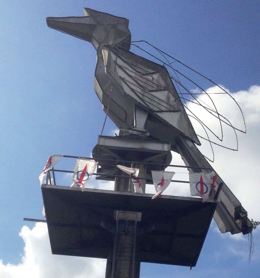 DAP flags spotted around the 40-foot hornbill statue along Tun Jugah Road in Kuching, December 26, 2015. — Picture by Sulok Tawie