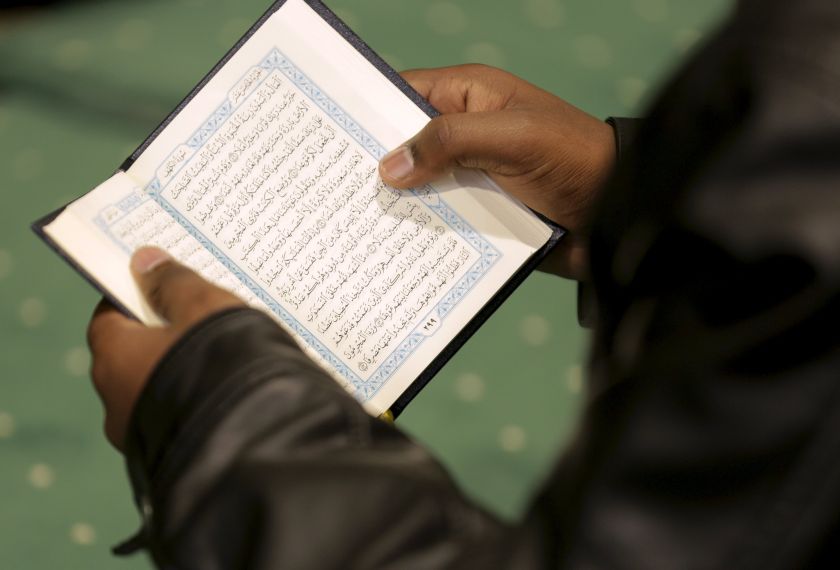 A man reads the Quran during Friday prayer service at the All Dulles Area Muslim Society in Sterling, Virginia December 19, 2015. u00e2u20acu2022 Reuters pic