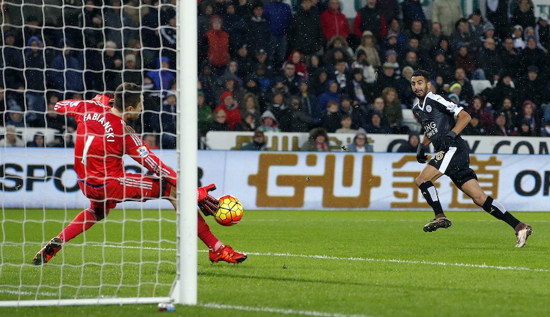 Riyad Mahrez scores the third goal for Leicester City to complete his hat trick during the Swansea City v Leicester City Barclays Premier League match at Liberty Stadium. u00e2u20acu201d Reuters pic
